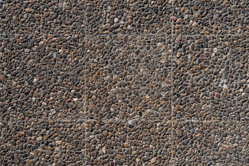 Texture of paved tiles with pebbles on the street