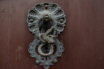 Forged elements on the old front door