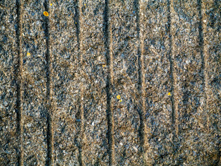 Obraz premium Granite stone surface with cut out marks. Abstract background for design