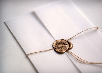 Fototapeta premium White envelope with a seal. Light background