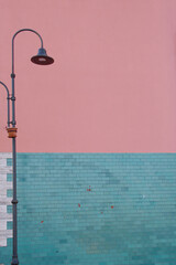 City street lamp with the background of a colored wall