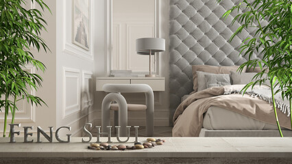 Wooden vintage table shelf with pebble balance and 3d letters making the word feng shui over classic romantic bedroom with bedside table and chair, zen concept interior design