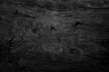 Naklejka premium Black wood board texture background. Close-up.
