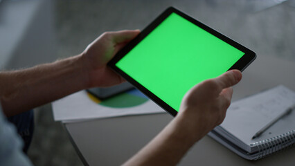 Man hands using tablet device green screen research business finance in office.