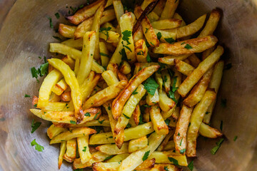 Bowl of french fries with a parsley