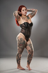 Glamour plus size model with tattoos
