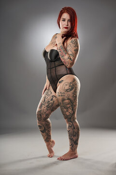 Glamour plus size model with tattoos