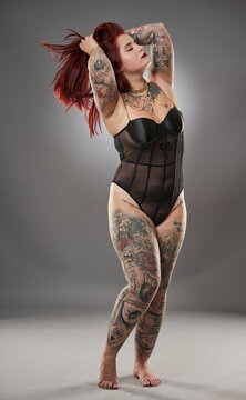 Glamour plus size model with tattoos