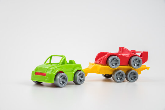 Multicolored plastic toy car. Buses. Equipment. © baxys
