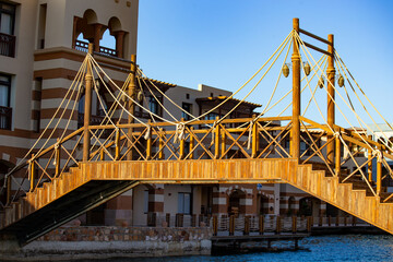 Fototapeta na wymiar Traditional wooden bridge in Port Ghalib marina, Marsa Alam, Egypt