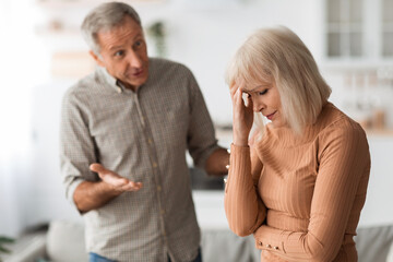 Aggressive Senior Husband Shouting At Wife Having Quarrel At Home