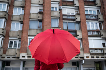 red umbrella in front of the building