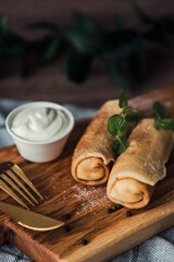 Pancakes with cottage cheese on a wooden plate