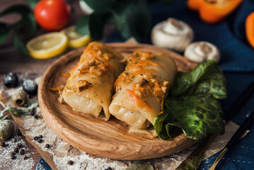 Meat in cabbage on a wooden plate