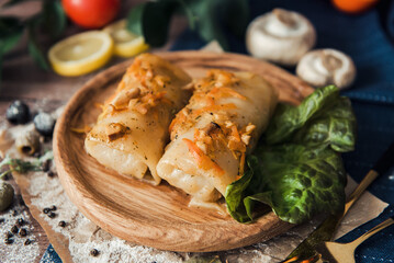 Meat in cabbage on a wooden plate