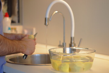 person preparing food in kitchen