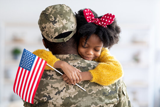 Happy Little Black Daughter Hugging Her Soldier Dad After Came Back Home