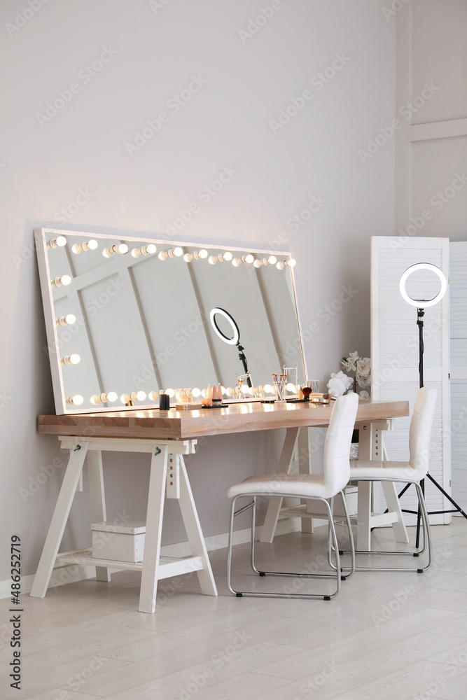 Sticker Modern mirror with light bulbs on dressing table in makeup room