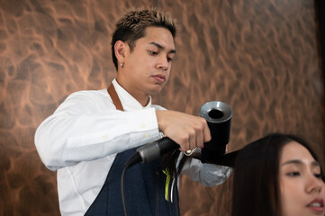 Fototapeta premium hairdresser and beautiful client woman making treatment hair health care in fashion style salon