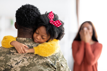 Happy Reunion. Excited Family Welcoming Soldier Father At Home After Army