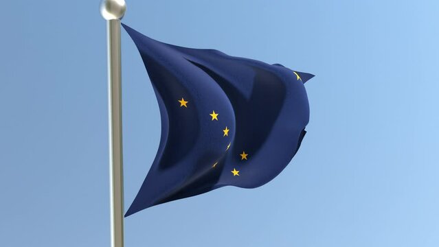 Alaska flag on flagpole. AK flag fluttering in the wind.