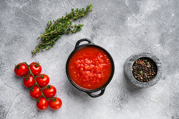 Tomato puree, on gray stone table background, top view flat lay, with copy space for text