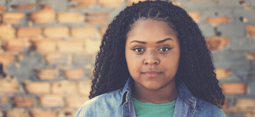 Portrait of serious african american young adult woman