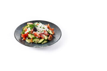 Traditional Bulgarian shopska salad with tomato,cucumber and bulgarian sirene cheese isolated on white background