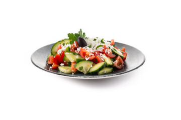 Traditional Bulgarian shopska salad with tomato,cucumber and bulgarian sirene cheese isolated on white background