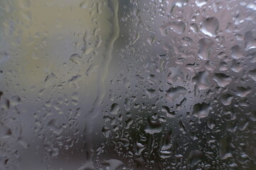 Raindrops on the window.Many raindrops in rainy day.Natural pattern on the glass.