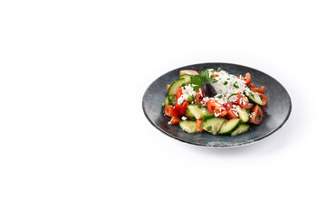 Traditional Bulgarian shopska salad with tomato,cucumber and bulgarian sirene cheese isolated on white background