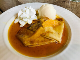 Dish of Crepe Suzette with Vanilla Ice Cream in Thailand.