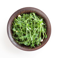 Fresh microgreens of pea in ceramic bowl isolated on white background with clipping path