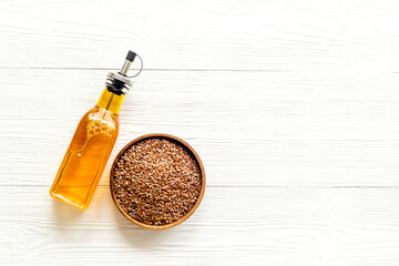 Sesame cooking oil in bottle with seeds. Cooking oil background
