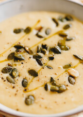 Close-up of celeriac cream soup with pumpkin seeds