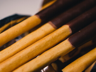 Chocolate-coated biscuit sticks