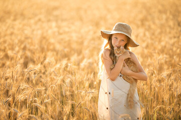 girl in a field with a cat © Oksana Arhangelova