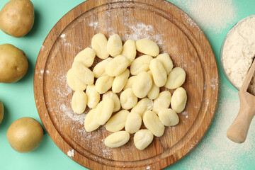 Concept of cooking with raw potato gnocchi, top view