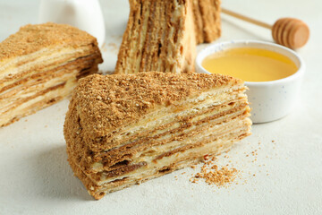Concept of tasty dessert with honey cake, close up