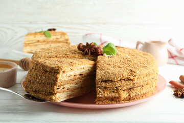 Concept of tasty dessert with honey cake, close up