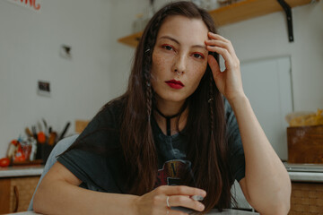 young woman at home on the kitchen