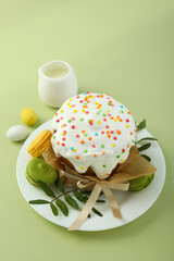 Concept of tasty Easter food on green background