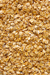 Oatmeal as a background with place for text. Porridge oats for dietary nutrition.