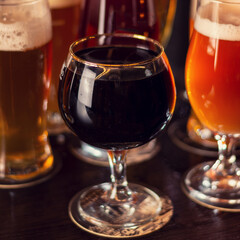 porter dark beer on wooden table square