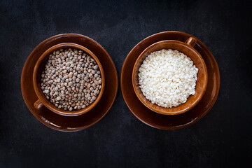 Rice and lentils on a dark background. Complete protein sources. Complete vegan protein. Healthy...