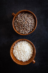 Rice and lentils on a dark background. Complete protein sources. Complete vegan protein. Healthy food