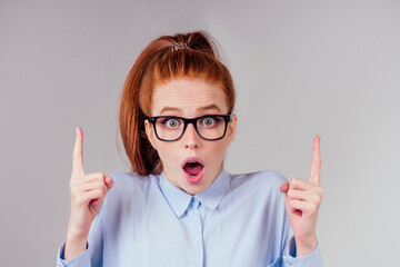 amazed redhair ginger woman worried, fear expression in studio background