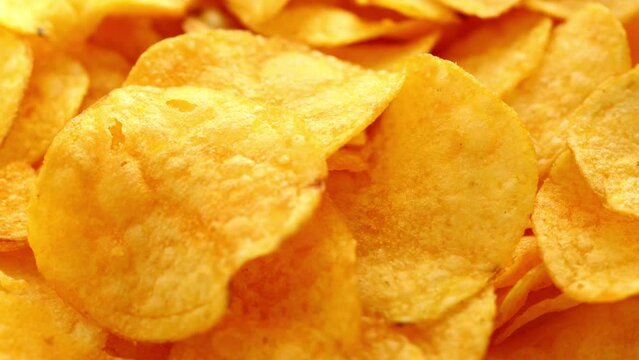 a bunch of golden chips spin in a circle