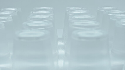 close up of stacked plastic cups isolated on grey