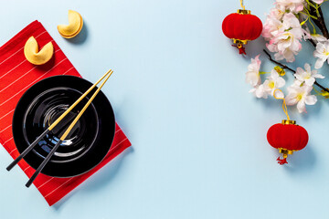 Asian table setting with Chinese New Year ornament